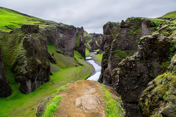 Unbelievable summer view of Fjadrargljufur canyon and river. Spectacular morning scene of landscape in South east Iceland, Europe. Selective focus