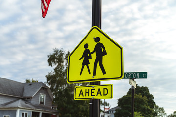 an school crosswalk ahead traffic sign in a road