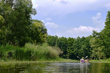 Vorskla river, tourists on a kayak.