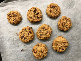 Paleo Chocolate Chip Cookies Made with Coconut and Almond Flour on Baking Paper.