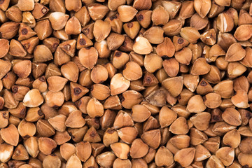 Macro Photo food buckwheat groats. Texture background grain buckwheat groats. Image food product porridge buckwheat grains