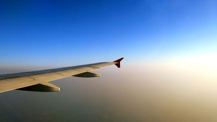 Looking at the sky in the morning on the plane.