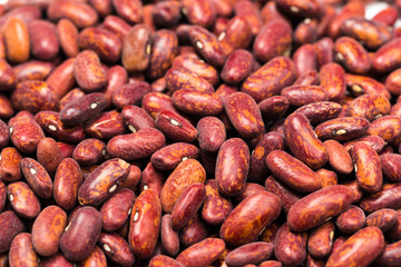 Red kidney bean texture background. Also called Rajma or Mexican Bean. A large, kidney-shaped bean with a subtle sweet flavor and soft texture that keep their shape during cooking.