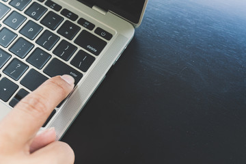 Close up of right hand fingers Of Asian men Deciding to press enter button for laptop