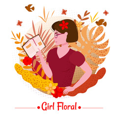 Cute girl with book among the leaves and flowers of exotic plants in a T-shirt