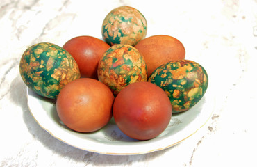 Colorful Easter Eggs On White Plate Placed By Heap