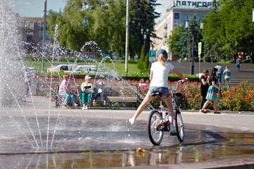 Children near a splashing fontain in the center of town 12 June 2016 Pyatigorsk, Russia, Town Square