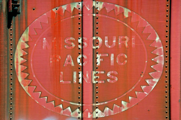 Old fadded sign on “Missouri Pacific Lines” metal railroad boxcar