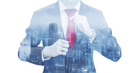 Businessman tying red necktie, double exposure futuristic city, on white background
