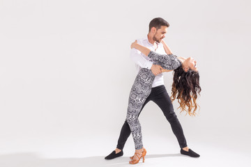 Salsa, kizomba, tango and bachata dancers on white background with copy space. Social dance concept