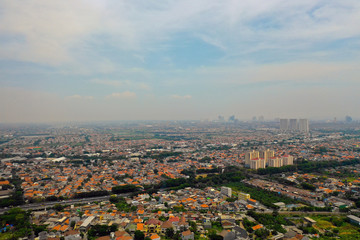 Obraz premium Aerial cityscape modern city Surabaya with skyscrapers, buildings and houses. city skyline with skyscrapers and business centers Surabaya capital city east java, indonesia