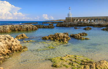 Fototapeta na wymiar The white lighthouse of Otranto town, Salento peninsula, Apulia region, Italy.