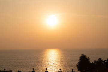 sunset, sun, nature, building, background, sea, texture, light, day, outdoor, yellow, travel, beauty, dusky, water, landscape, view, seashore, sand, waves, tree, coconut, blue, structure, stone, templ