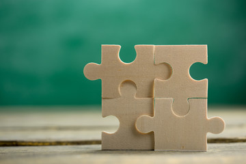 Creative solution for idea - business concept, jigsaw puzzle on the blackboard