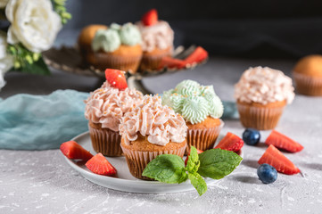 Homemade tasty cupcakes with fresh berries