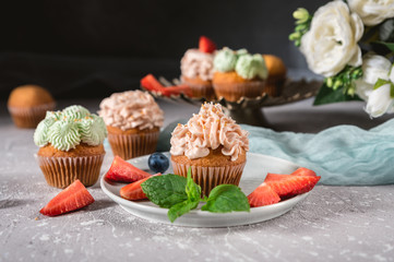 Homemade tasty cupcakes with fresh berries