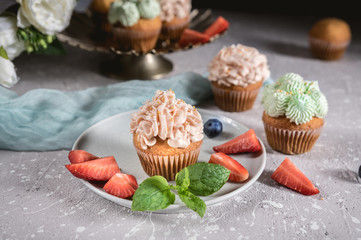 Homemade tasty cupcakes with fresh berries