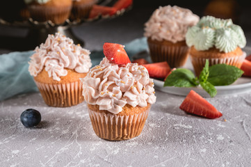 Homemade tasty cupcakes with fresh berries