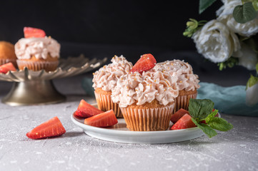 Homemade tasty cupcakes with fresh berries