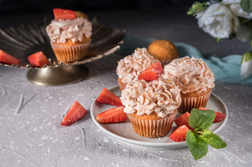 Homemade tasty cupcakes with fresh berries