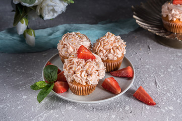 Homemade tasty cupcakes with fresh berries