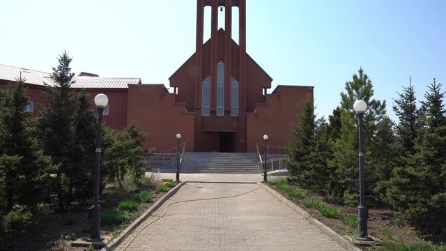  Nur-Sultan Astana Our Lady Of Perpetual Help Roman Catholic Cathedral Frontal View of Main Entrance on a Sunny Blue Sky Day