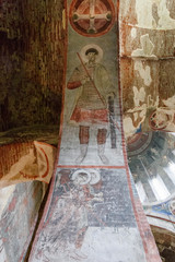 Fototapeta na wymiar Timotesubani, Georgia-May,04 2019: Interior Church Assumption Blessed Virgin Mary in Timotesubani male Monastery. Painted in years 1205-1215, one of most difficult painting