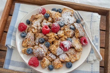 Kaiserschmarrn - traditional austrian pancake dessert with fresh fruit