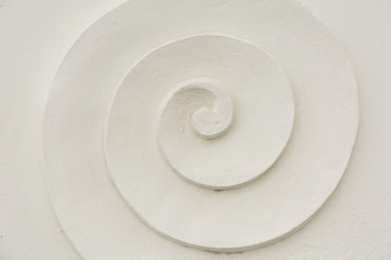 Fototapeta na wymiar White plaster spiral. Macro background.