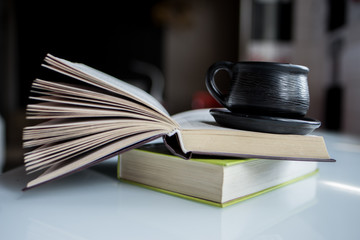 old books and glasses cup coffee