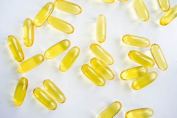 fish oil capsules on white background