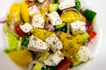 fresh salad with feta cheese and olives