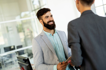 Business people having fun and chatting at workplace office