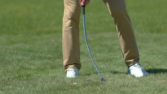 Golf beginner player trying to make shot but slicing too much practice on course