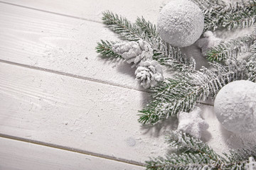 Christmas card - Christmas tree branches on the wooden background