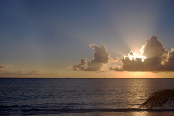 The sun sets behind the clouds in Zanzibar