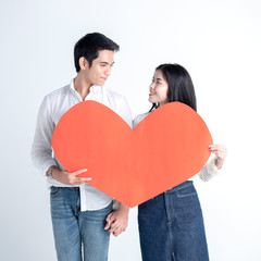 valentines day, love and people concept - happy couple with red heart shaped balloons, Roses, Big Red heart Paper over white background