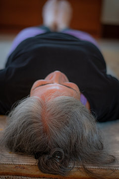 Senior Indian Woman Doing Yoga At Home Early In The Morning. India Has Been Suffering With A Surge Of Lifestyle Diseases Such As Diabetes And Hypertension. Only A Few People Are Taking Precautions .