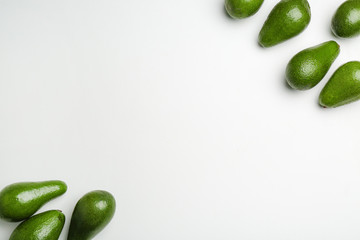 Fresh avocados on light background