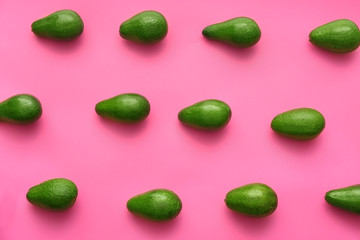 Fresh avocados on color background