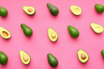 Fresh avocados on color background