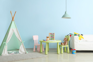 Interior of modern children's room with teepee