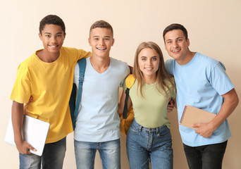 Portrait of young students on light background
