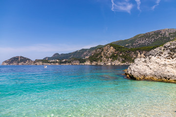 Rovinia beach in Liapades. One of greek island Corfu natural beach view with crystal clear water. Corfu, Greece.