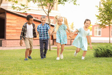 Fototapeta premium Cute little children running in park
