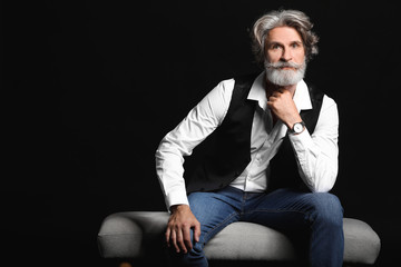 Fashionable senior man on dark background