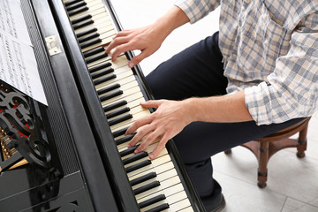 Man playing grand piano at the concert