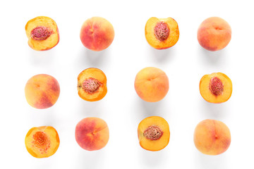 Many ripe peaches on white background