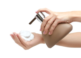 Female hands with soap on white background