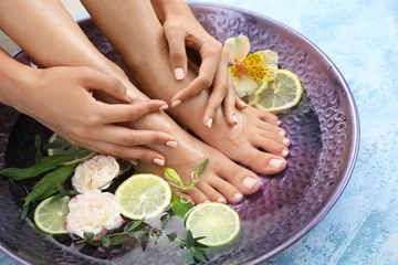 Wall murals Pedicure Young woman undergoing spa pedicure treatment in beauty salon